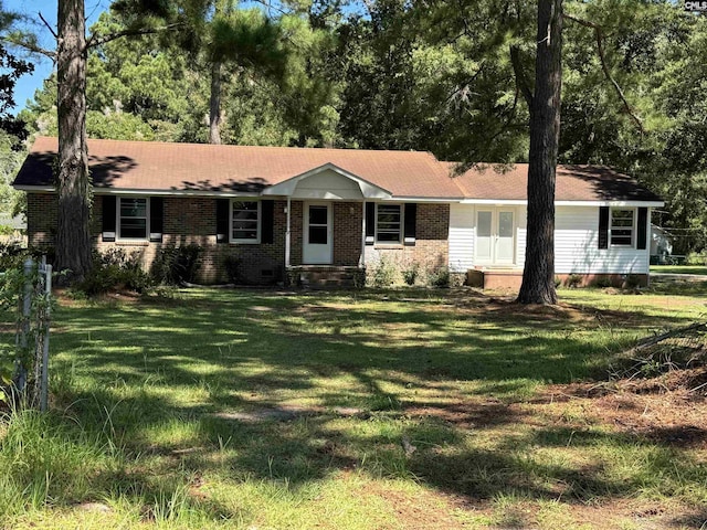 ranch-style home with brick siding and a front yard