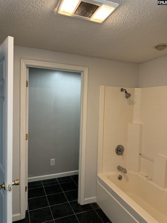 full bathroom with washtub / shower combination, a textured ceiling, tile patterned flooring, and visible vents