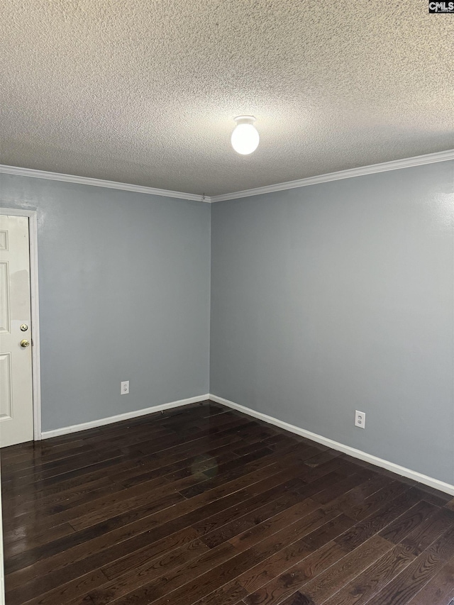 unfurnished room featuring baseboards, ornamental molding, and dark wood finished floors