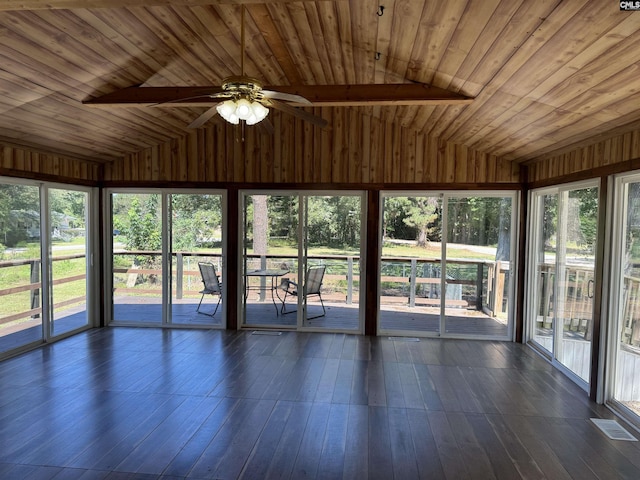 unfurnished sunroom featuring lofted ceiling, wood ceiling, and ceiling fan