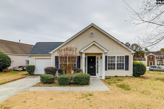 view of front facade featuring a front lawn, driveway, a shingled roof, and an attached garage