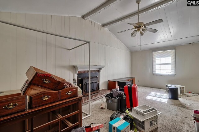 interior space featuring ceiling fan and lofted ceiling with beams
