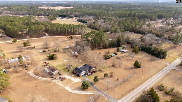 drone / aerial view with a rural view and a view of trees