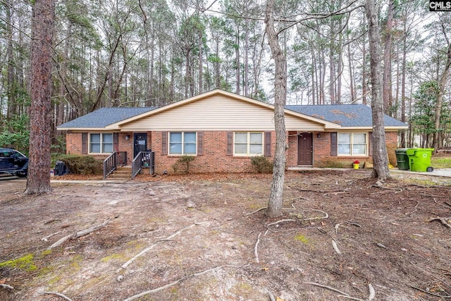 ranch-style house with brick siding