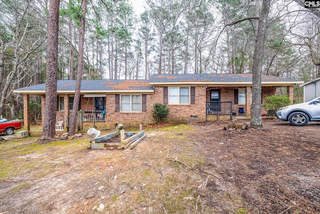 ranch-style house with crawl space, a porch, and brick siding