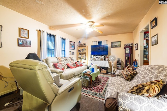 carpeted living area featuring a ceiling fan and a textured ceiling