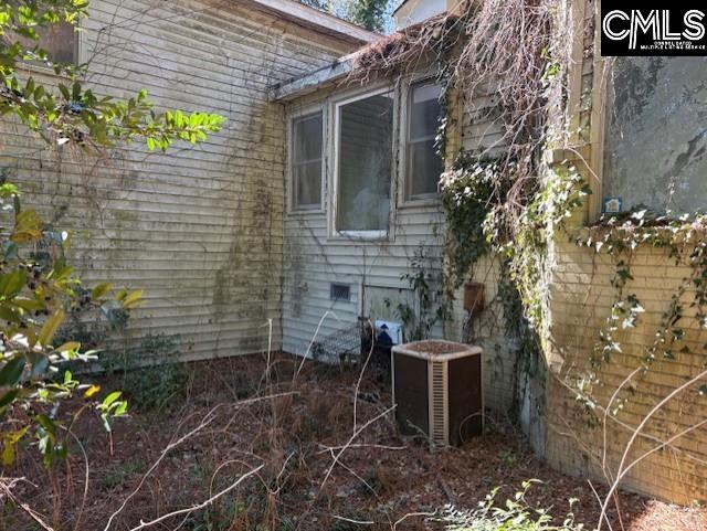 view of side of home featuring central air condition unit