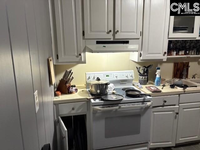 kitchen featuring electric stove, open shelves, light countertops, white cabinetry, and under cabinet range hood