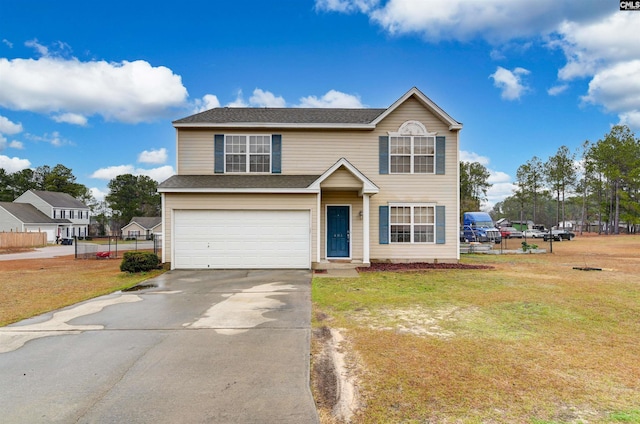 traditional-style home featuring a shingled roof, an attached garage, a front yard, fence, and driveway