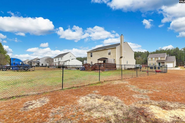 view of yard with a residential view and fence