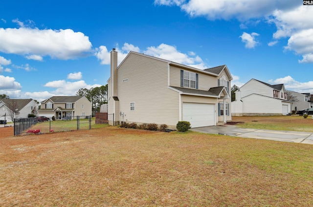 view of side of property with an attached garage, fence, concrete driveway, a lawn, and a residential view