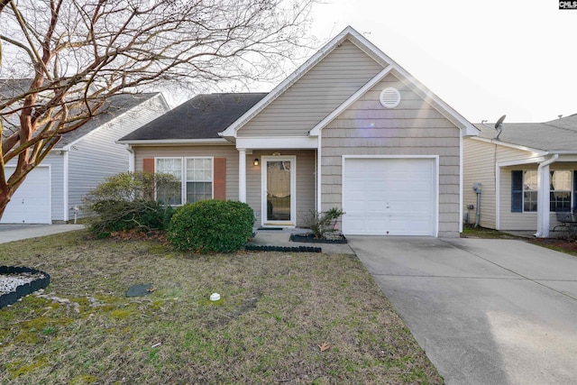 view of front of property with a garage, driveway, and a front yard