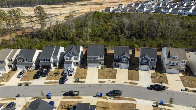 birds eye view of property with a residential view