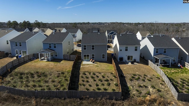 birds eye view of property with a residential view