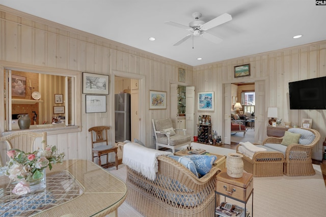 living area featuring a ceiling fan and recessed lighting