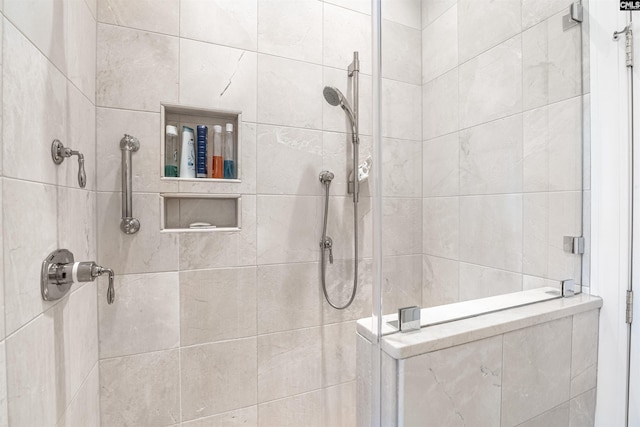 bathroom with a tile shower