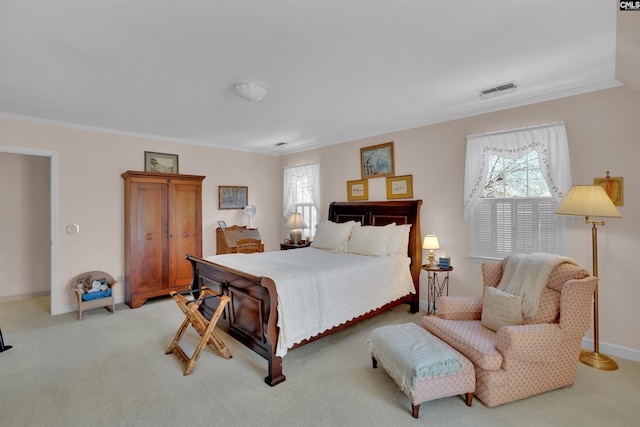 bedroom featuring baseboards, multiple windows, visible vents, and crown molding