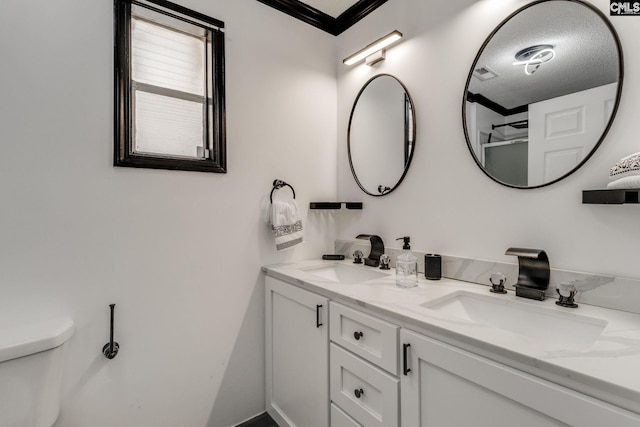 307 Wyoming Dr, Sumter, SC 29153 - bathroom featuring double vanity, visible vents, toilet, and a sink