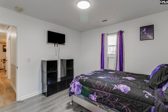 307 Wyoming Dr, Sumter, SC 29153 - bedroom with visible vents, baseboards, and wood finished floors