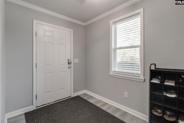 307 Wyoming Dr, Sumter, SC 29153 - entrance foyer featuring crown molding, plenty of natural light, wood finished floors, and baseboards