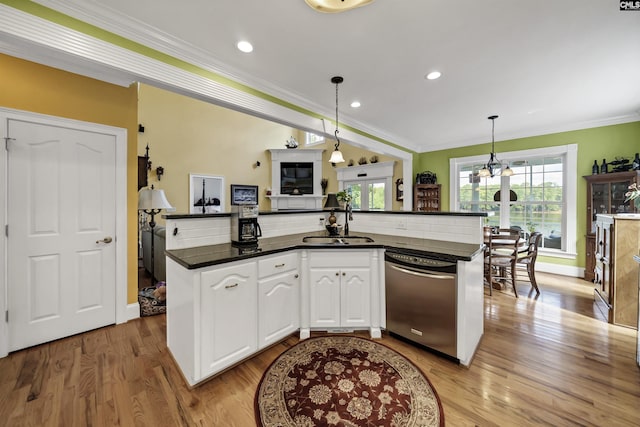 kitchen with pendant lighting, light wood-style floors, white cabinets, dishwasher, and crown molding