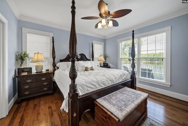 bedroom featuring crown molding, baseboards, and dark wood-style flooring