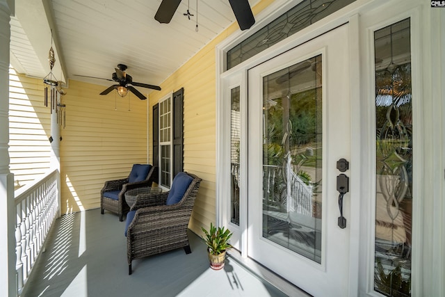 balcony with ceiling fan and a porch