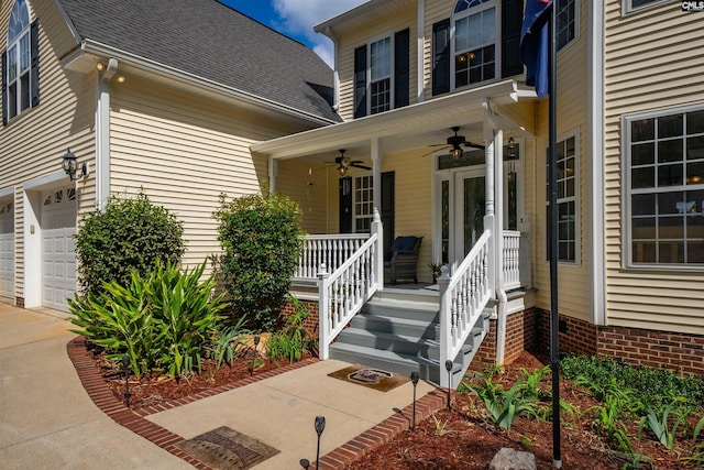 doorway to property with ceiling fan, driveway, and a shingled roof