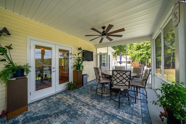 sunroom / solarium featuring ceiling fan, french doors, and wood ceiling