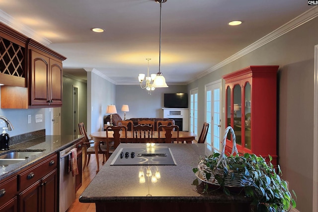 kitchen featuring stainless steel dishwasher, crown molding, black electric cooktop, and a sink