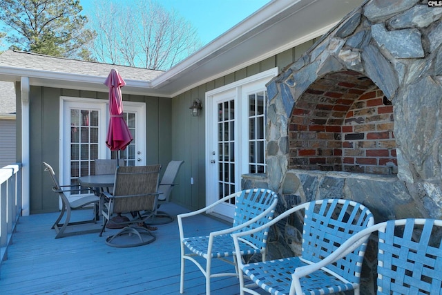 wooden deck featuring outdoor dining space