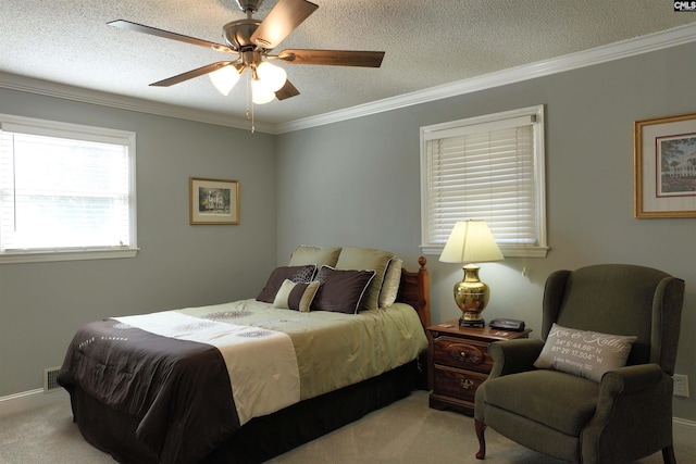 bedroom featuring ornamental molding, light carpet, and a textured ceiling