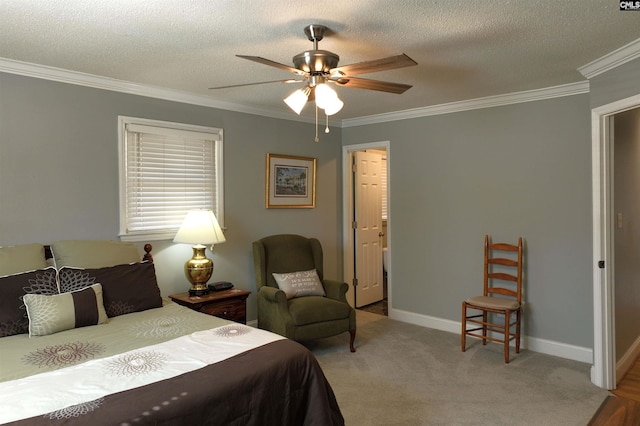 bedroom with baseboards, ornamental molding, a textured ceiling, and light colored carpet