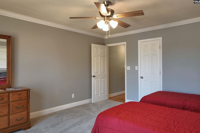 bedroom with crown molding, a textured ceiling, baseboards, and light colored carpet