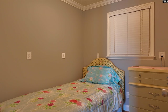 bedroom with ornamental molding