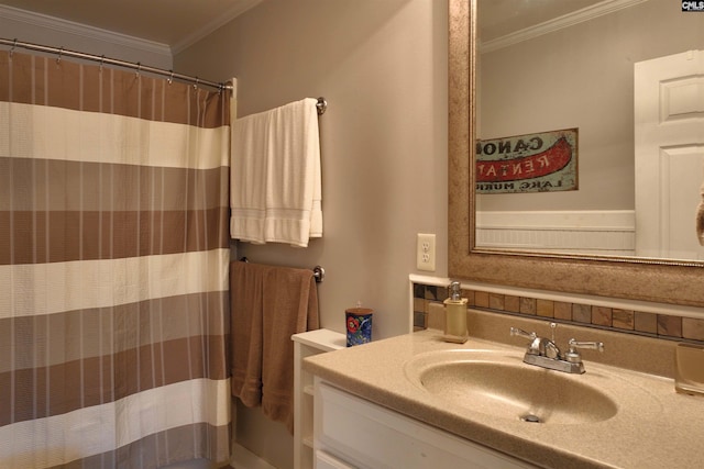 full bath featuring ornamental molding and vanity