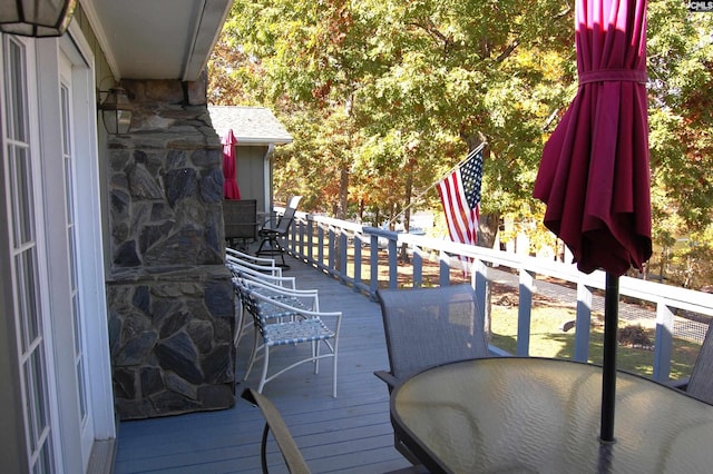 wooden deck featuring outdoor dining space