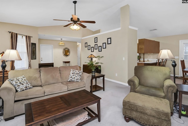 living area featuring light carpet, vaulted ceiling, baseboards, and ceiling fan