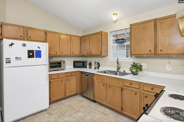 kitchen featuring brown cabinets, light countertops, vaulted ceiling, a sink, and white appliances