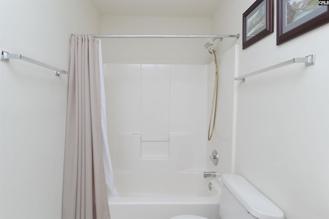 bathroom with shower / bath combo and toilet