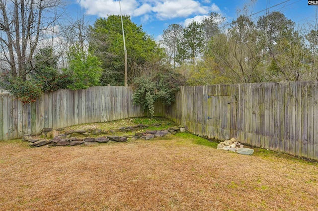 view of yard featuring a fenced backyard