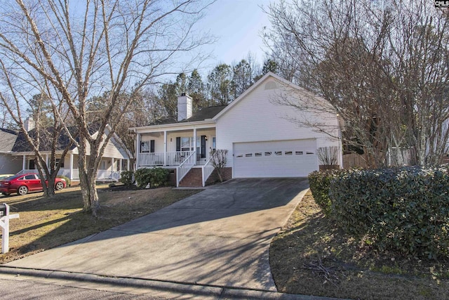 view of front of property featuring a porch, concrete driveway, a chimney, and an attached garage