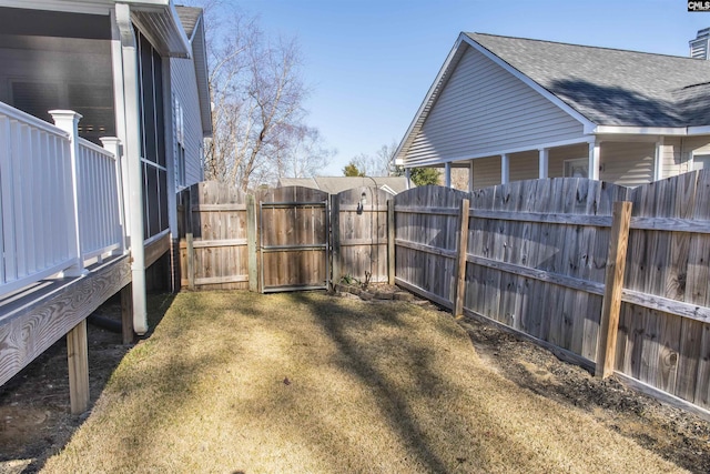 view of yard featuring a gate and fence