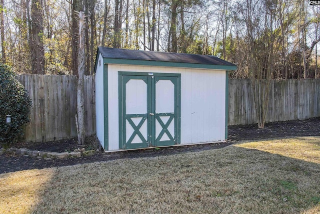 view of shed with a fenced backyard