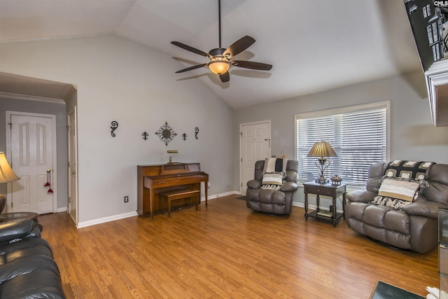 living area featuring ceiling fan, high vaulted ceiling, light wood-style flooring, and baseboards