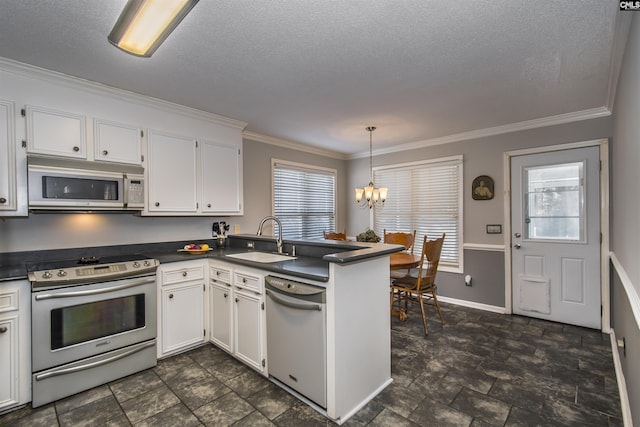 kitchen featuring white dishwasher, dark countertops, white cabinets, and stainless steel range with electric cooktop