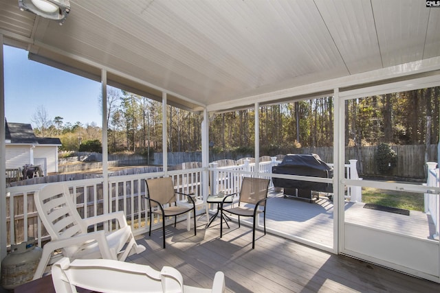 sunroom with wooden ceiling