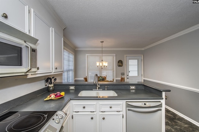 kitchen with white appliances, dark countertops, a sink, and white cabinets
