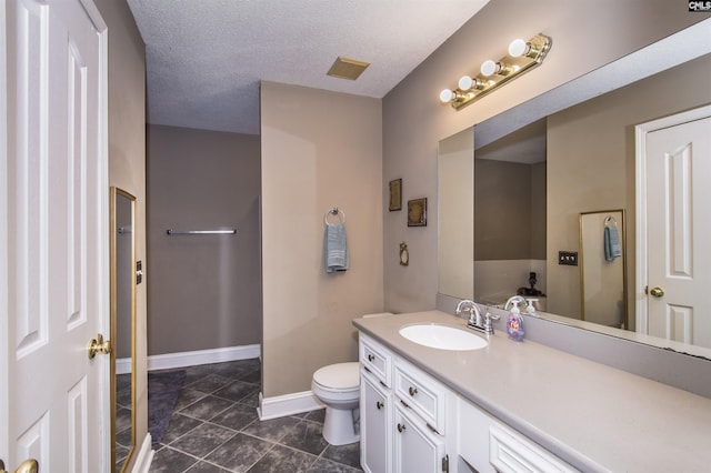 full bathroom featuring visible vents, vanity, a textured ceiling, baseboards, and tile patterned floors