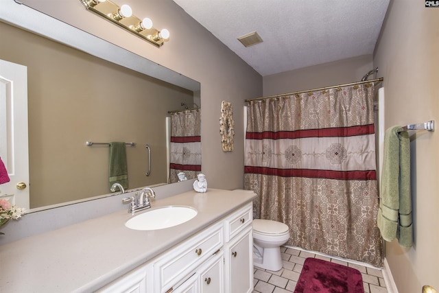 bathroom featuring visible vents, toilet, tile patterned flooring, a textured ceiling, and vanity